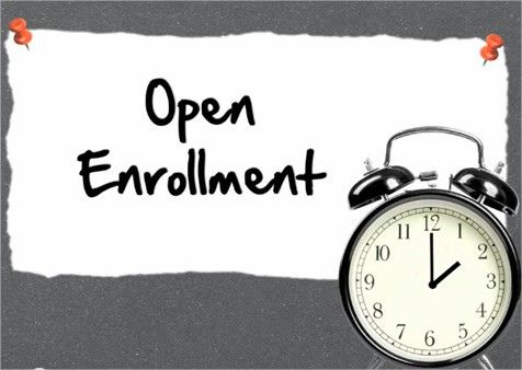 Open Enrollment on paper with clock